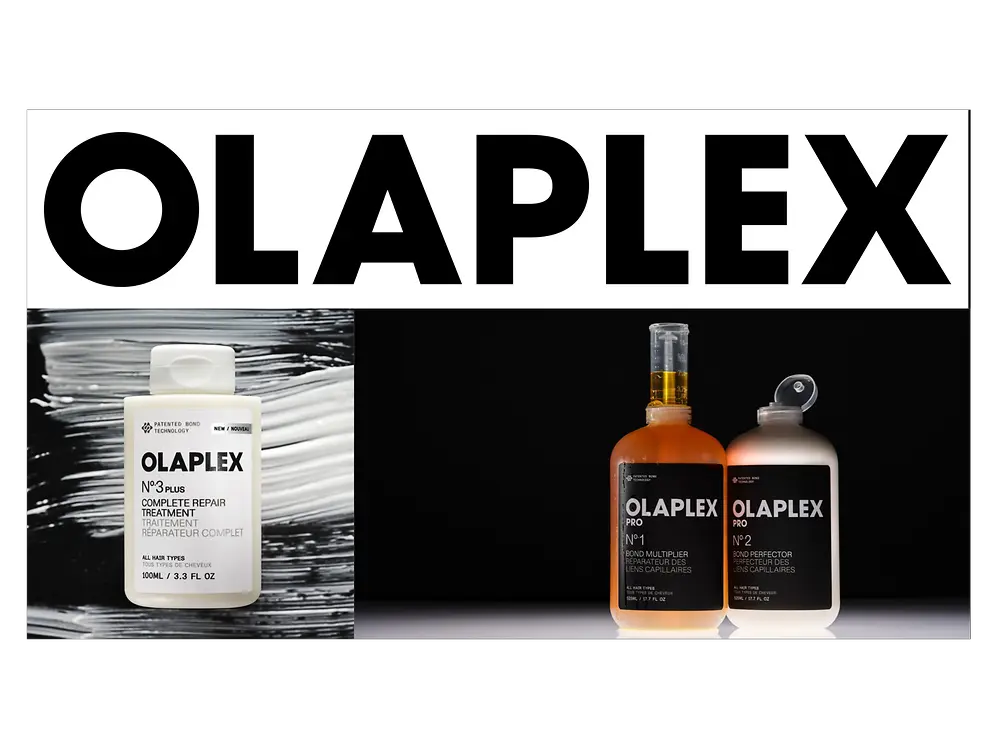 Fotografía de producto que muestra el logotipo de “OLAPLEX” en letras negras sobre fondo blanco y, debajo, varios productos para el cuidado del cabello. A la izquierda se observa un frasco blanco de Olaplex N°3 sobre un fondo negro con pinceladas blancas. A la derecha aparecen dos botellas transparentes con líquido ámbar etiquetadas como Olaplex Pro N° 1 y Olaplex Pro N° 2 sobre un fondo negro.
