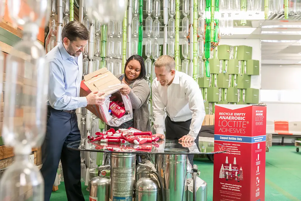 TerraCycle employee demonstrating how to handle the recycling boxes to her project partners from Henkel at TerraCycle headquarters.