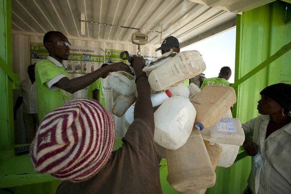 The Plastic Bank creates a ladder of opportunity: People living in poverty can collect plastic waste from the local environment and bring it to a plastic collection center.